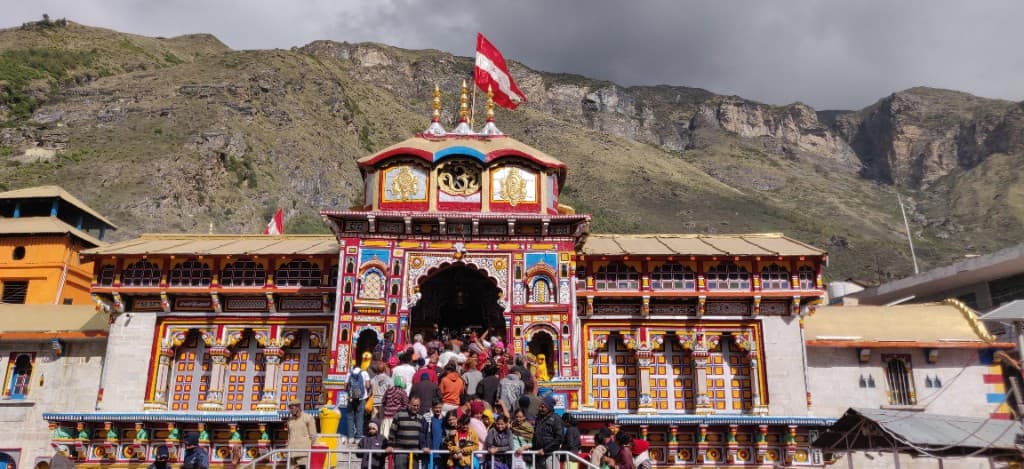 Colorful Badrinath Temple facade with mountain backdrop