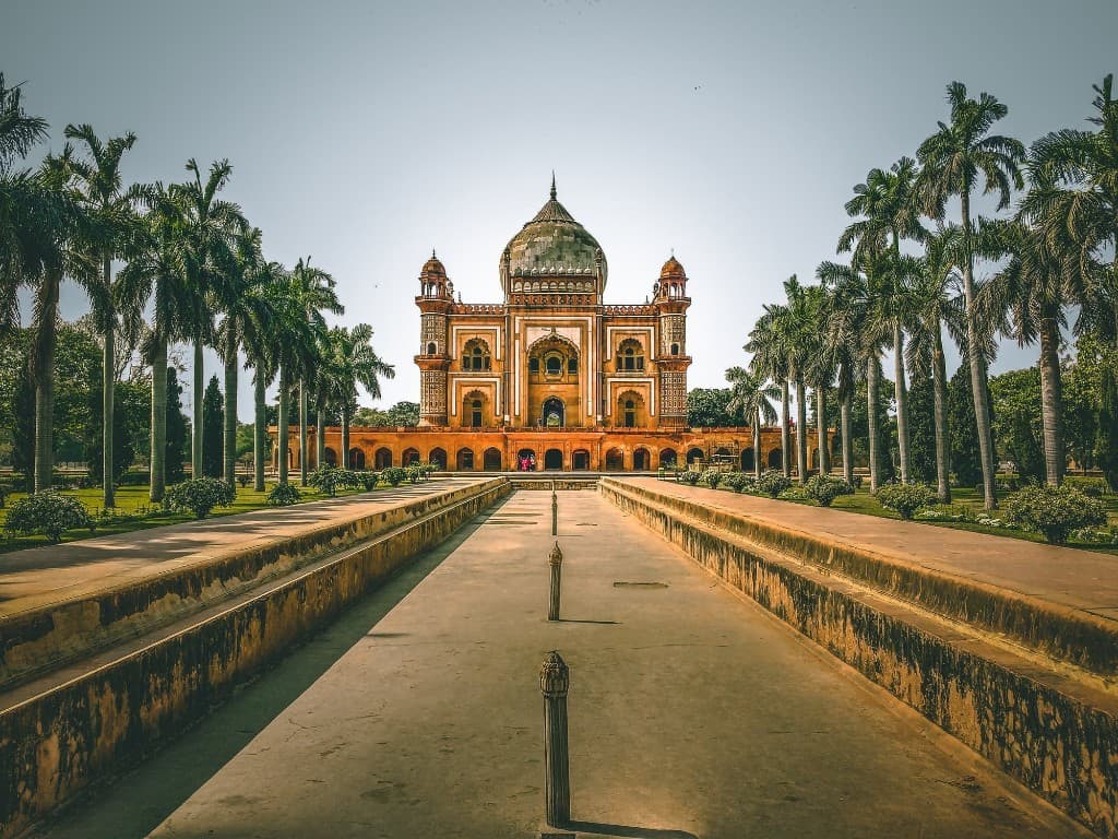 Safdarjung's Tomb with palm-lined pathway in Delhi